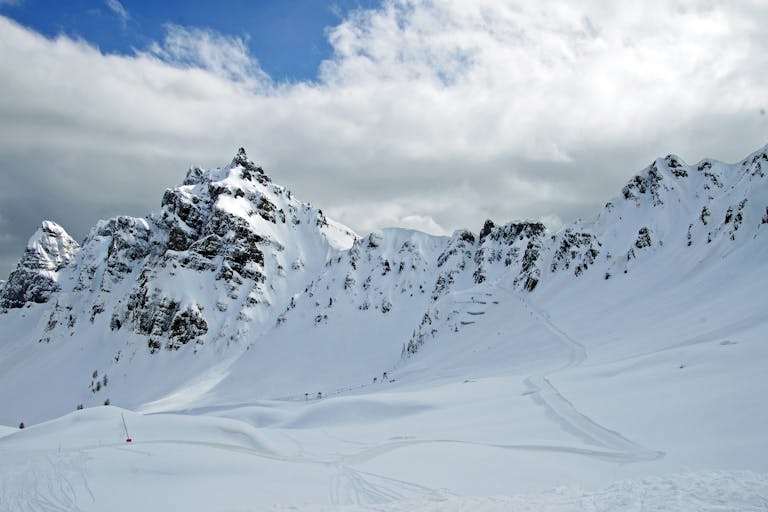 Breathtaking snowy mountain with clear skies, ideal for winter sports and adventure.